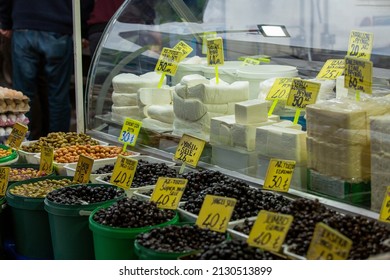 A market selling cheese in bazaar in Antalya. No Visible Trademark: All labels are types of cheese and olives. Example : Turkish ; Az yağlı Sele  = English; Low-fat Saddle Olive
