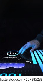 Marketer in dark clothing touching interactive digital screen with glowing blue analytics, bar charts, and circular data interface. Concept of business, technologies, data, engineering. Ad