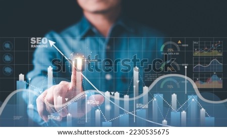 Marketer pointing to graph and showing concept SEO Optimization Analyzer search engine ranking Social media sites based on results analytics data.