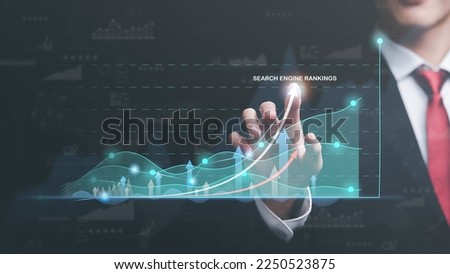 Marketer pointing to graph and showing concept SEO Optimization Analyzer search engine ranking Social media sites based on results analytics data,marketing strategy to make consumers discover website