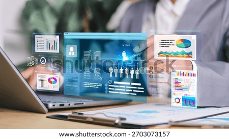 Marketer using digital marketing dashboard with charts, pie graphs, organization chart, and performance data. Concept of business analytics and strategic planning.