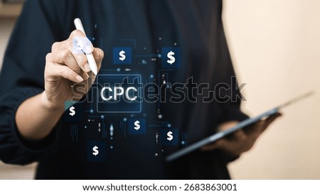 Marketers tap a glowing CPC button with a stylus amid dollar icons, demonstrating pay-per-click advertising, PPC bidding, keyword targeting, and optimization in their digital marketing efforts.