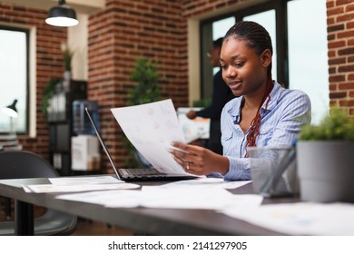 Marketing Agency Office Person Having Management Documentation While Sitting At Desk. Young Confident Business Woman Reviewing Accounting Annual Results And Financial Plan.