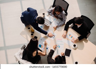 Marketing Analysis Accounting Team Teamwork Business Meeting Concept. Top view in office while people having a meeting - Shutterstock ID 1655770000