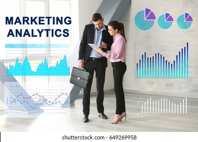 Marketing Analytics Concept. People Discussing Business Ideas In Office