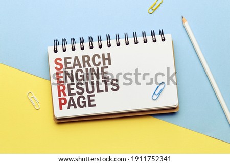 Marketing buzzword serp. Term Search engine results page on notepad.