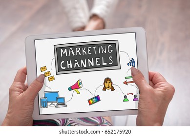 Marketing Channels Concept Shown On A Tablet Held By A Woman