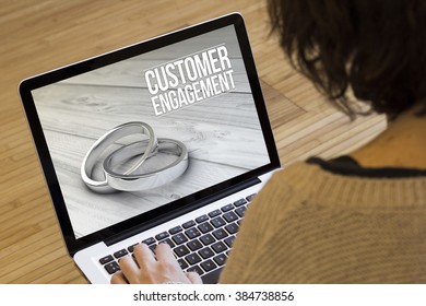 marketing online concept: customer engagement on a laptop screen. Screen graphics are made up.