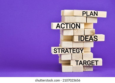 MARKETING PLAN Concept With Wooden Blocks. Plan, Ideas, Action, Strategy, Target - Written In The Wood Blocks On Purple Background. Wooden Tower. Concept Business. Very Peri - Color Of The Year 2022