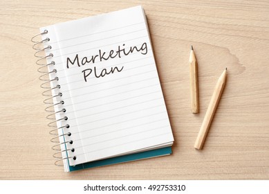 marketing plan on notebook on desk