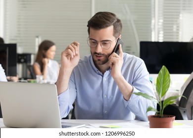 Marketing Sales Manager Consulting Client Making Offer Selling Talking On Phone Near Laptop In Office, Serious Business Man Making Call Negotiating Speaking By Mobile Holding Interview On Cellphone