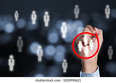 Marketing target audience concept , Businessman writing red circle to mark to focus customer group. - Shutterstock ID 1820990621