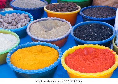 Marketstall selling ingredients. Traditional spices market. colored spices at local market. Beautiful vivid oriental market with baskets full of various spices. Spice market