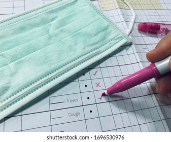 Marking On A Check Sheet. Concept About Coronavirus Screening Checklist.
