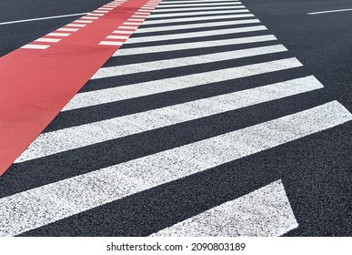 Markings of a crosswalk and bike path on a asphalt road. Roads infrastructure and transport 