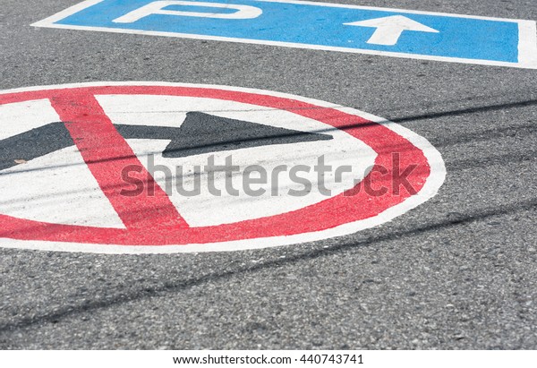 Marks on the road\
do not\
turn right