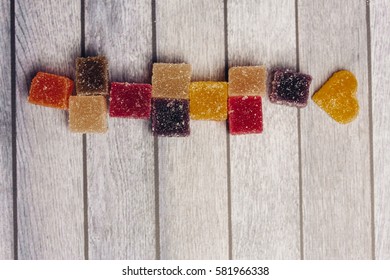 Marmalade on a wooden background.