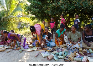 MAROANTSETRA, MADAGASCAR OCTOBER 23.2016 Malagasy women from village selling traditional souvenir village street. Madagascar countryside scene. Maroantsetra, Madagascar October 23. 2016