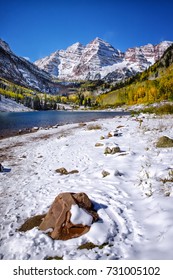 Maroon Bells In Winter Portrait With Rock