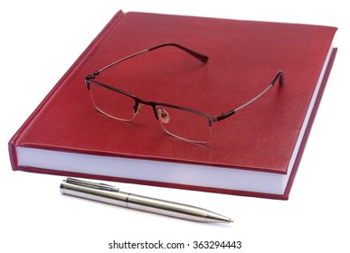 Maroon Colored Thesis Paper With Spectacles Over White Background