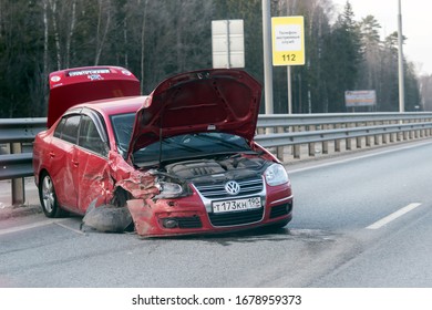 A Maroon Volkswagen Passat Car With Open Trunk And Bonnet Covers Smashed In An Accident On Simferopol Highway In The Moscow Region Russia March 2020.