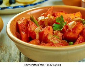 Marqa glarha,  pumpkin stew, Tunisian cuisine, Traditional assorted African dishes, Top view.