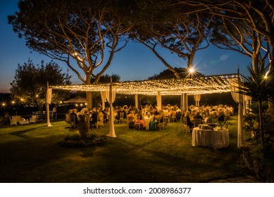 Marquee Lit  At Night In A  Traditional  Wedding In Italy, Summer 2021. Garden  Party In The Open