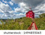 Marquette Harbor Lighthouse with catwalk on a sunny summer day