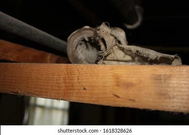 Marquette, MI / USA - April 27, 2010:  Wrap Style Asbestos Pipe Insulation On Heat Pipes From Boiler System In Basement Of Home.