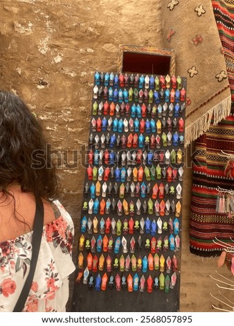 Marrakech Market board full of colourful hand-made wooden shoes.
