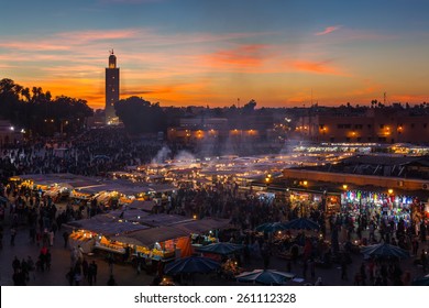 MARRAKESH, MOROCCO - DECEMBER 27: Crowd in Jemaa el Fna square at sunset on December 27, 2014 in Marrakesh, Morocco. Blur of moving objects and people to imply movement.
