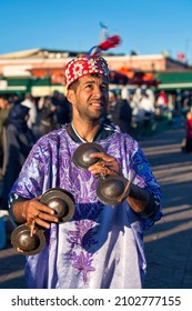 Marrakesh, Morocco - January 28 2019: Musician In Traditional Costume Playing With A Pair Of Krakebs In Djemaa El Fna Square.