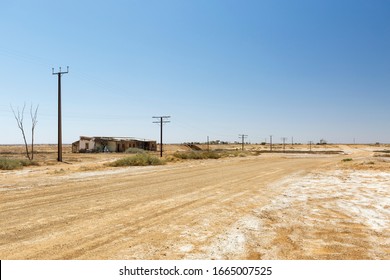 Marree Australian Outback abandoned derelict house on the side of a deserted dirt road and copy space in the outback town of Marree, South Australia - Shutterstock ID 1665007525