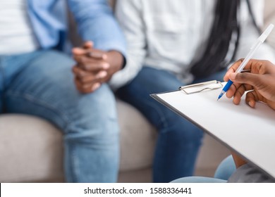 Marriage Counselor Taking Notes During Therapy Session With Black Married Couple, Selective Focus, Free Space