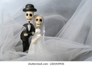 Marriage of a dead couple in Mexico
Figurines posing in a wedding veil in the celebration of the Day of the dead.

 - Shutterstock ID 2201929935