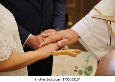 Marriage, Vow On The Cross, Newlyweds And A Catholic Priest