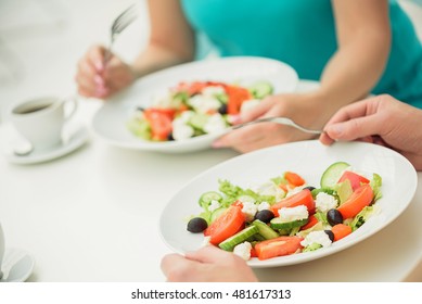 Married Couple Eating Fresh Salad