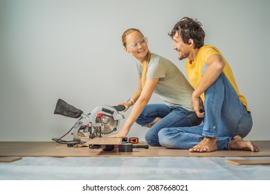 Married couple installing new wooden laminate flooring on a warm film floor. Infrared floor heating system under laminate floor - Shutterstock ID 2087668021