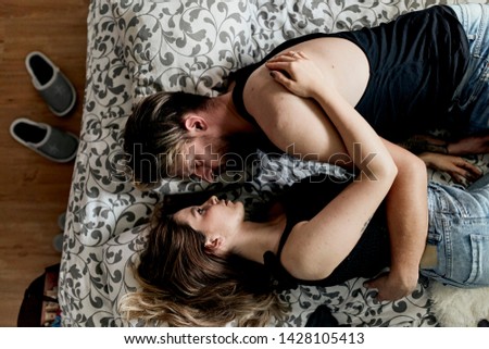 Similar – Happy young couple in love kissing under duvet cover