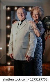 Married Couple. Older Man And Woman Hugging Each Other And Smiling. Old Man And Senior Woman Dancing. Happy Senior Couple