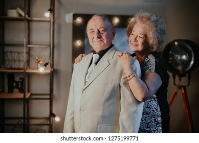 Married Couple. Older Man And Woman Hugging Each Other And Smiling. Old Man And Senior Woman Dancing. Happy Senior Couple