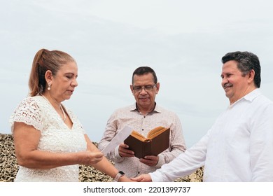 Married Couple Renewing Their Vows In The Open Air