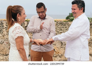 Married Couple Renewing Their Vows In The Open Air