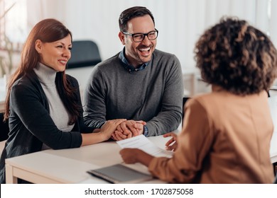 Married Couple Talking With Financial Advisor On A Meeting