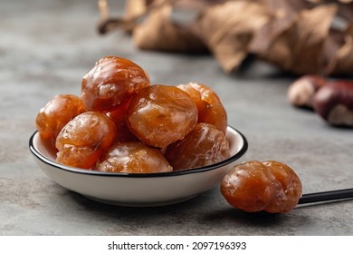Marron glace,  confection, originating in northern Italy and southern France consisting of a chestnut candied in sugar syrup and glazed.