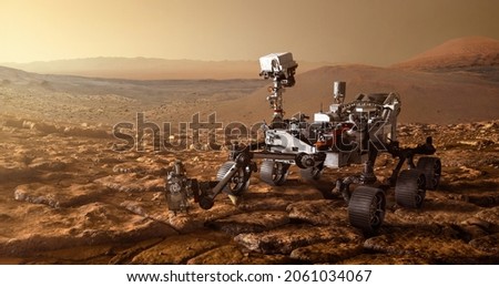 Mars Rover is exploring surface of Mars. Mission Mars exploration of red planet. Space exploration, science concept. .Elements of this image furnished by NASA.