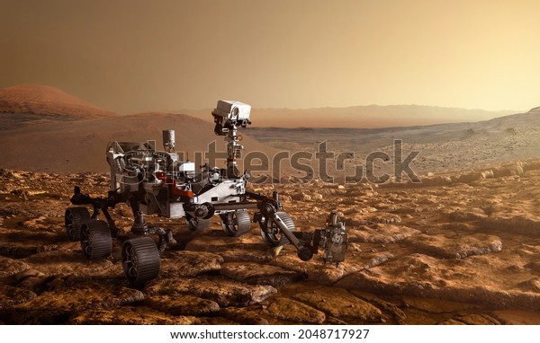  Mars Rover is\
exploring surface of Mars. Rover Mission Mars exploration of red\
planet. Space exploration, science concept. .Elements of this image\
furnished by NASA.