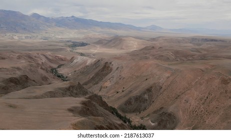 Mars Valley With Red Mountains In Altai, Kyzyl-Chin Valley, Siberia, Russia. Beautiful Summer Nature Landscape At During Daytime. Aerial View From A Drone