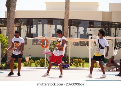  Marsa Alam, Egypt - September 24, 2021. Cute and funny dancing multinational animators by the swimming pool at hotel.                                  - Shutterstock ID 2090093659