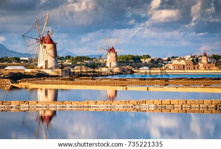 Marsala, Italy. Stagnone Lagoon with vintage windmills and saltwork, Trapani province, Sicily.